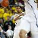 Michigan sophomore Trey Burke whips a pass in the second half of the game against Binghamton on Tuesday. Daniel Brenner I AnnArbor.com